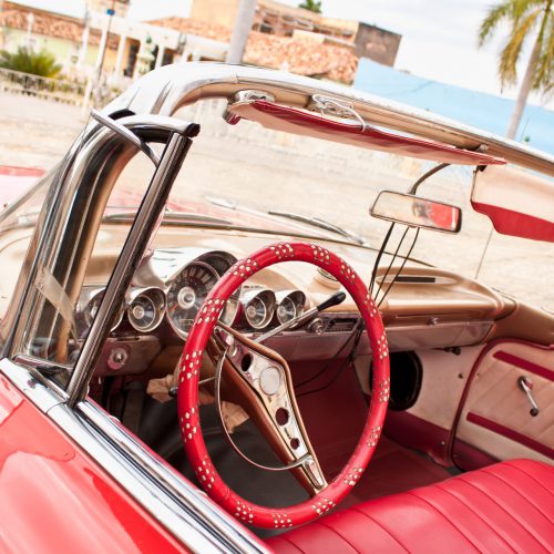Detail of  Red Classic Chevrolet in the central square of Trinidad, Cuba.